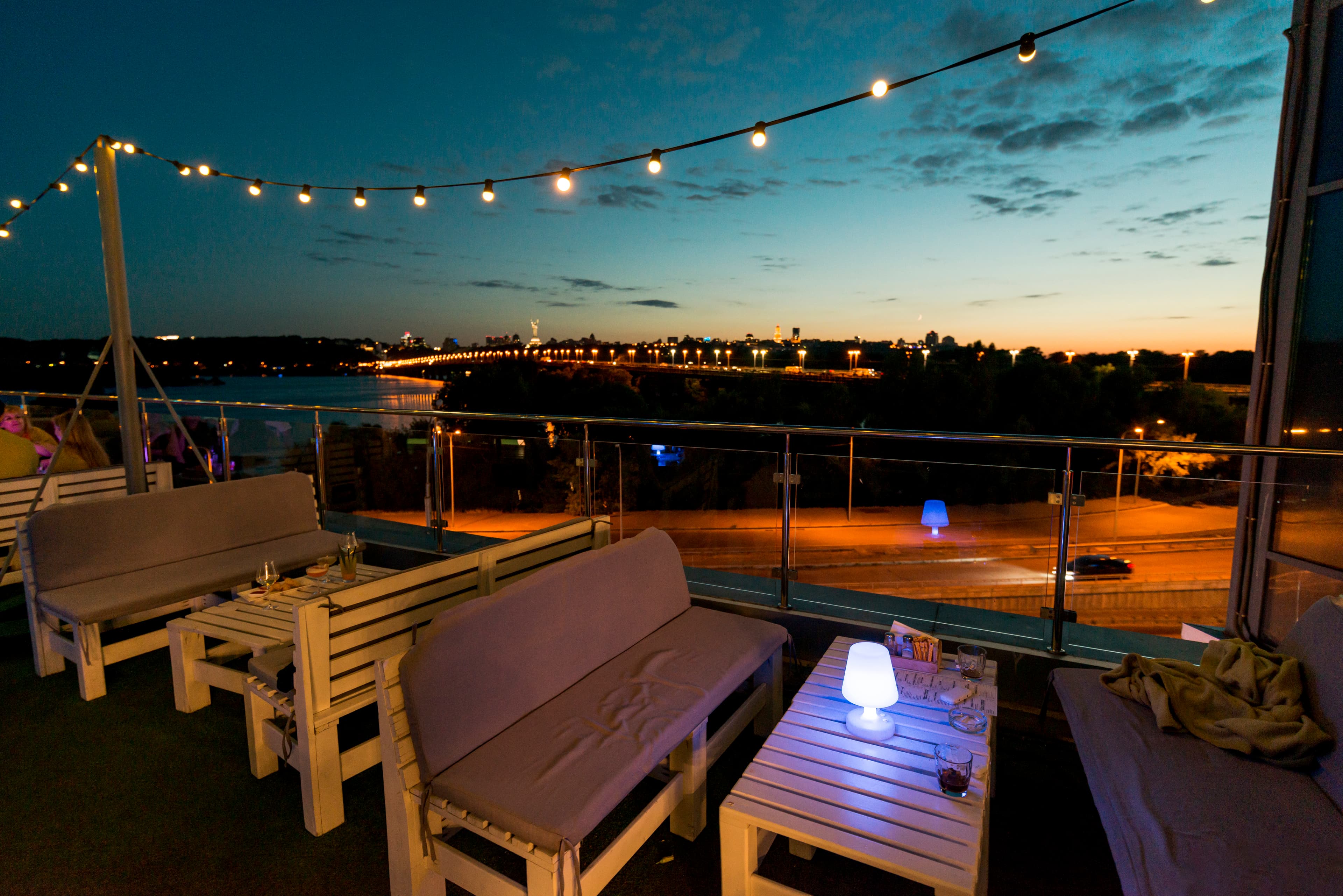 Outdoor patio seating area with string lights