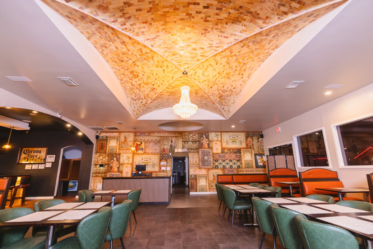 Warm and elegant interior of Veranda Bar & Restaurant with Indian-inspired decor