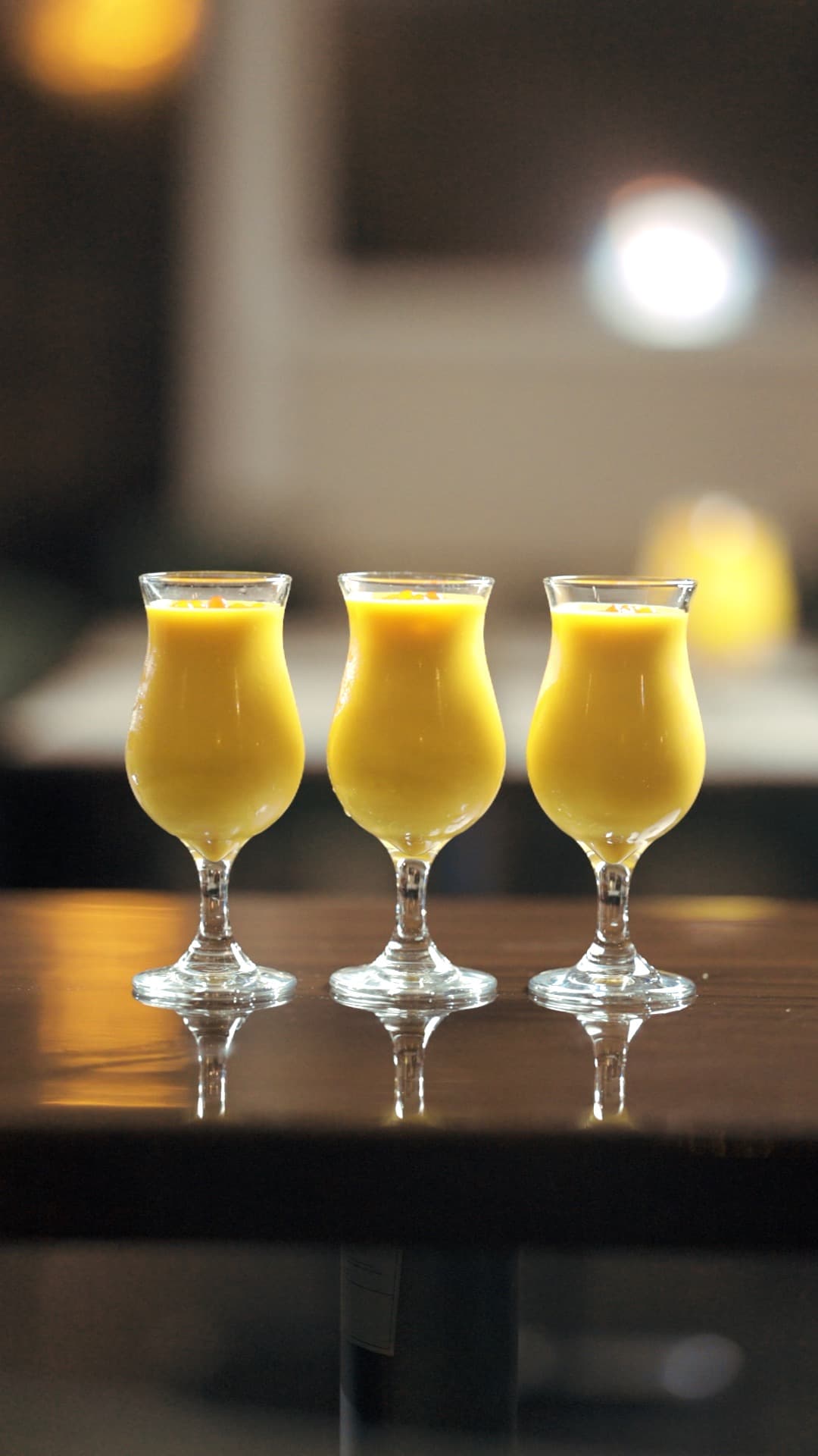 Traditional mango lassi and Indian beverages